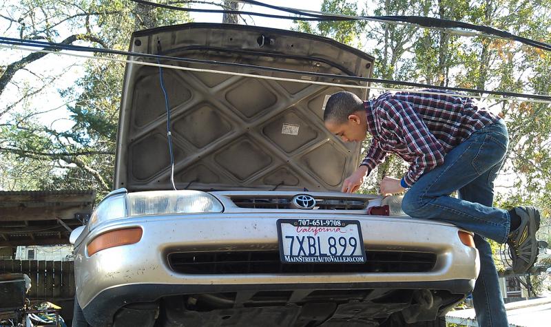 Philip Leaning over the Engine